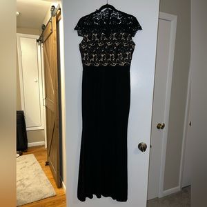 Black gown with lace detail. Size large. Slit in leg